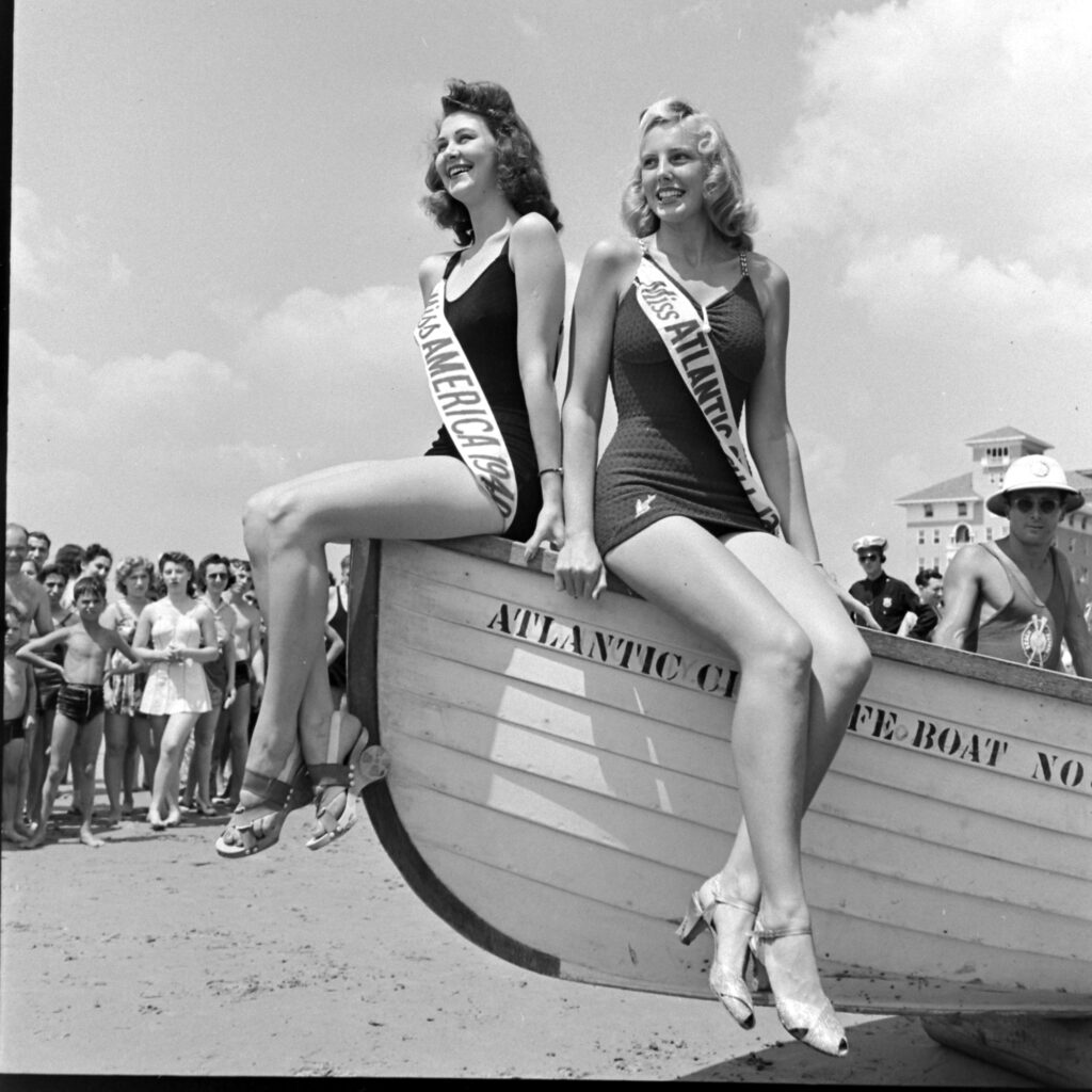 Frances Burke, winner of the 1940 Miss American pageant, joined Miss Atlantic City on the beach Atlantic City, N.J., 1941.